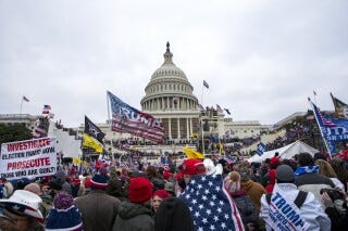 FILE - Insurrectionists loyal to President Donald Trump breach the U.S. Capitol in Washington on Jan. 6, 2021. A federal appeals court on Friday, Aug. 18, 2023, ordered a new sentence for a North Carolina man who pleaded guilty to a petty offense in the Capitol riot — a ruling that could impact dozens of low-level cases in the massive Jan. 6, 2021, prosecution. The appeals court said James Little was wrongly sentenced for his conviction on a misdemeanor offense to both prison time and probation, which is court-ordered monitoring of defendants who are not behind bars. (AP Photo/Jose Luis Magana, File)