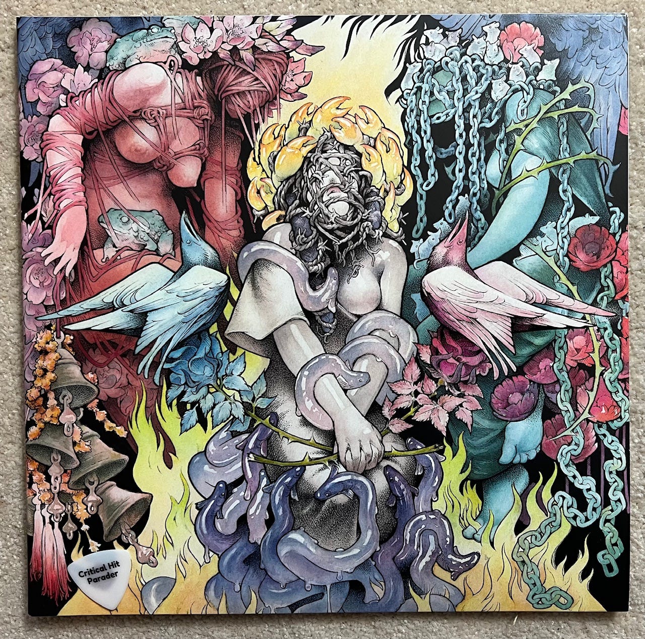 Baroness album cover. The central figure is winged with barbed vines wrapping around the face and eel-like creatures binding the arms.