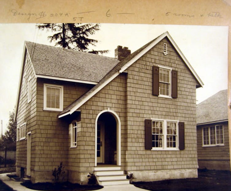 A sepia-toned photograph of a newly-built single-family house. A sepia-toned photograph of a newly-built single-family house.