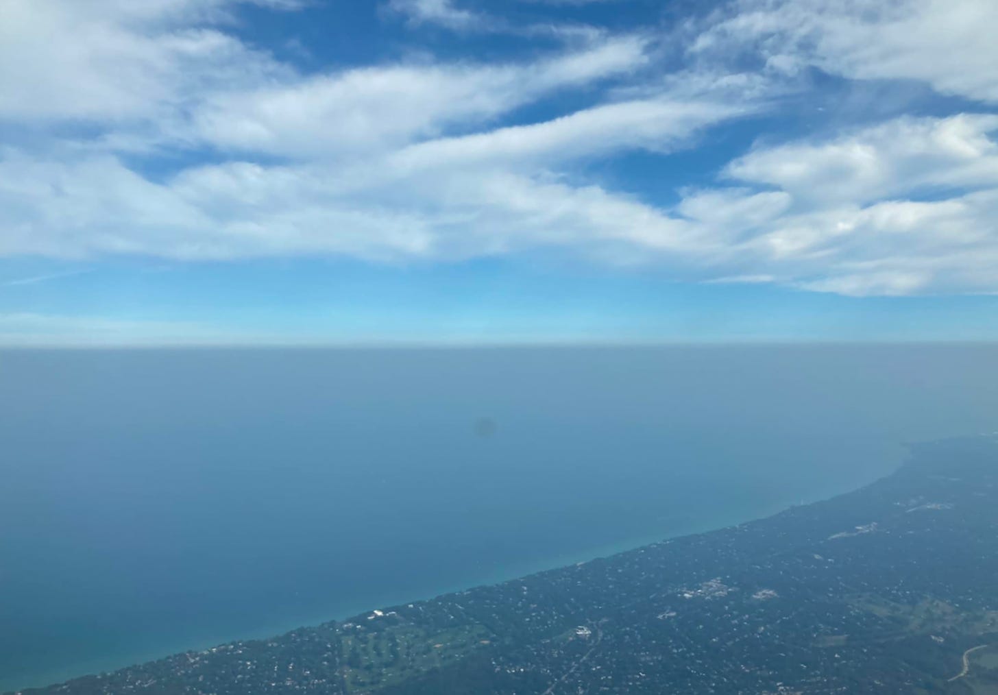 A view of Lake Michigan taken from a plane flying over.