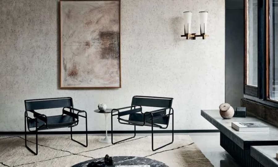 two black wassily chairs positioned in a lounge two black wassily chairs positioned in a lounge