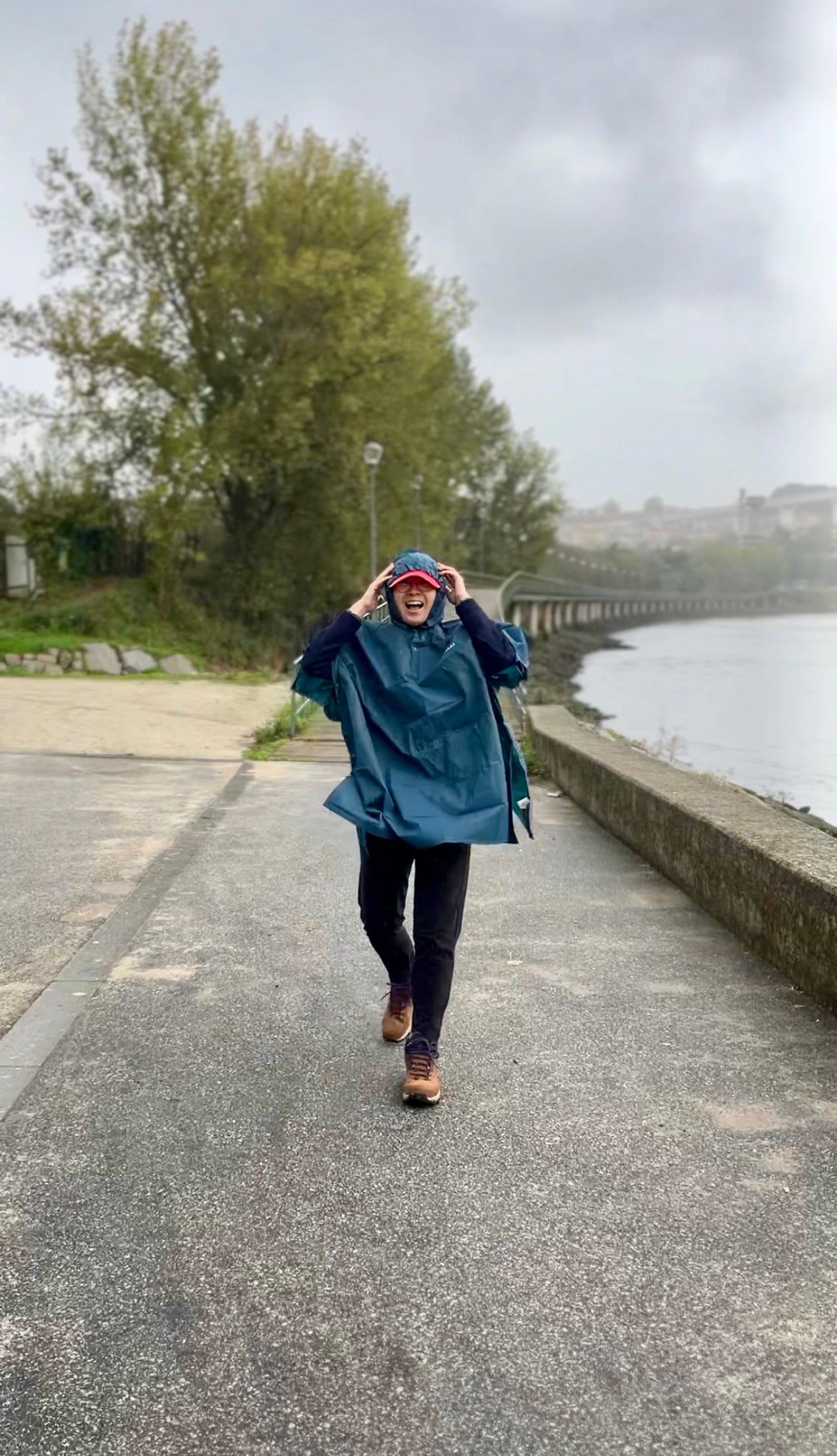 image: photo of me laughing, wearing a rain poncho