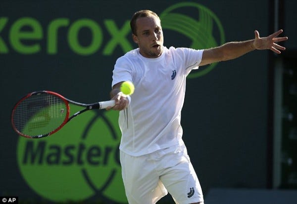 steve darcis tries to feel novak djokovics balls stroke at 2015 miami open masters