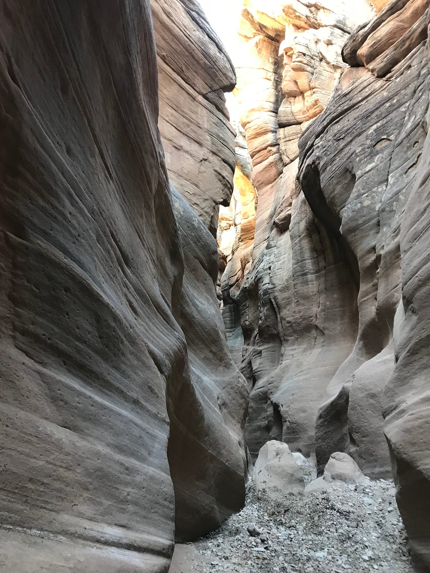 The limestone walls of a narrow slot canyon near Escalante, Utah.