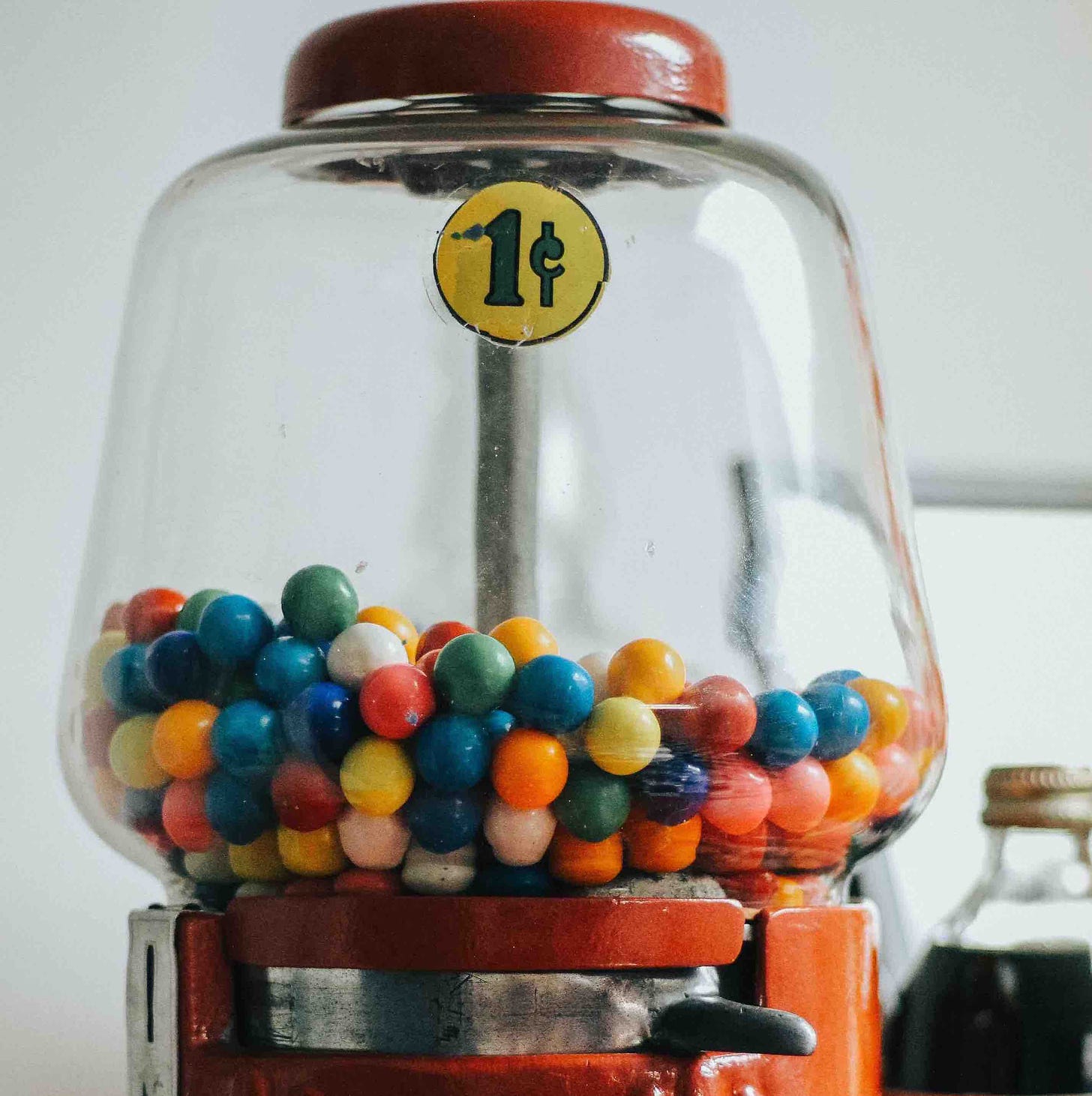 Vintage gum ball machine representing storage of low vibration emotions