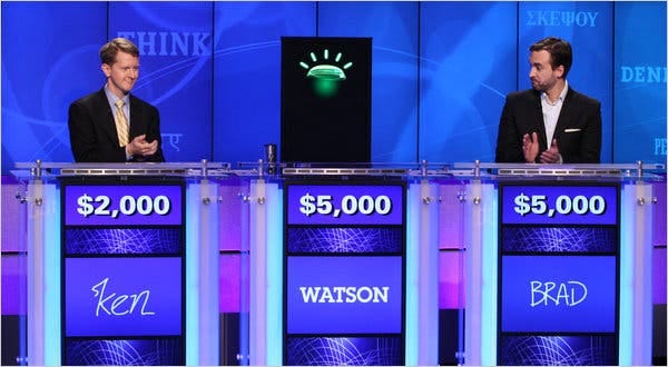 Two “Jeopardy!” champions, Ken Jennings, left, and Brad Rutter, competed against a computer named Watson, which proved adept at buzzing in quickly.