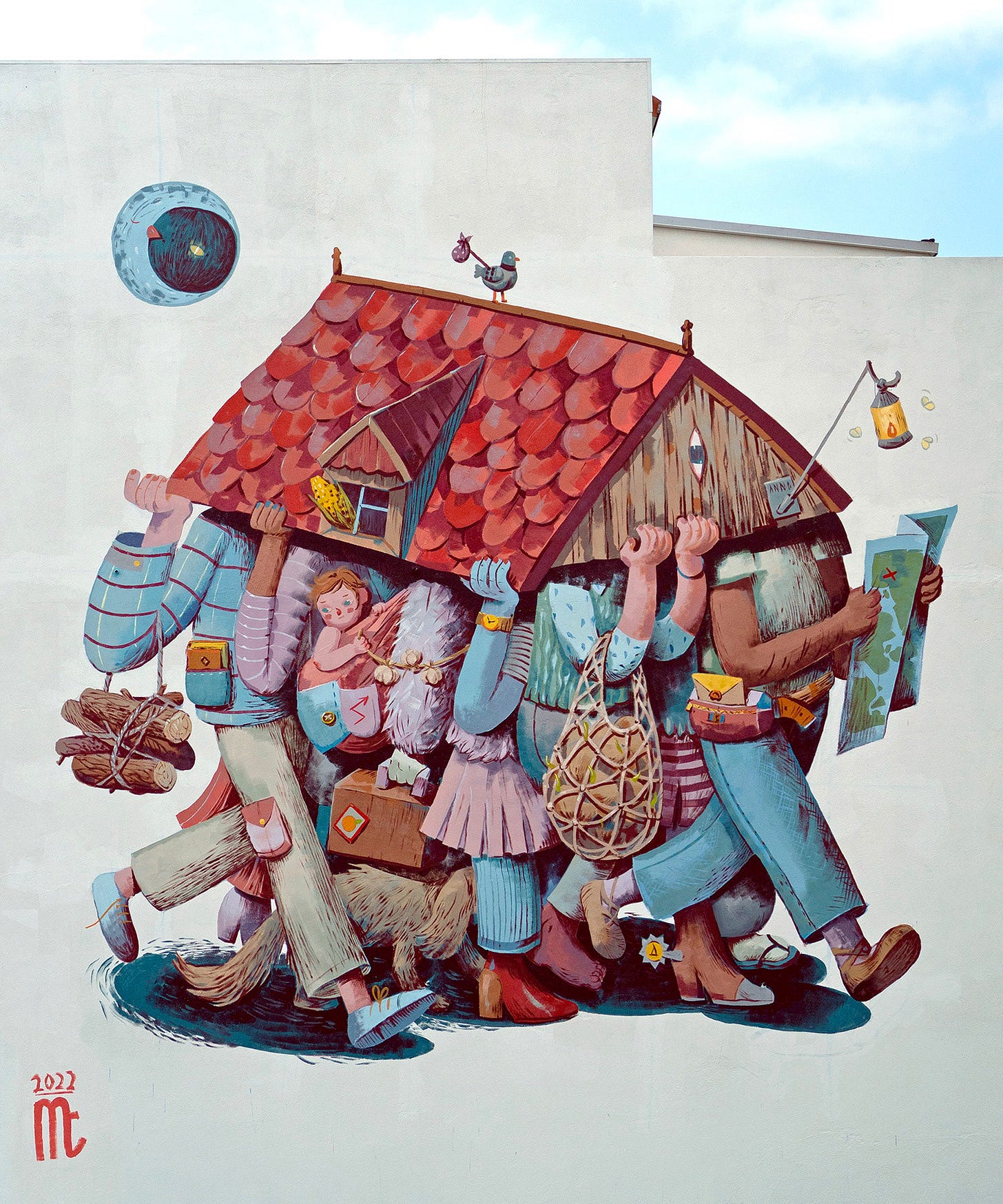 A mural on the side of a building portraying numerous figures carrying a house roof.