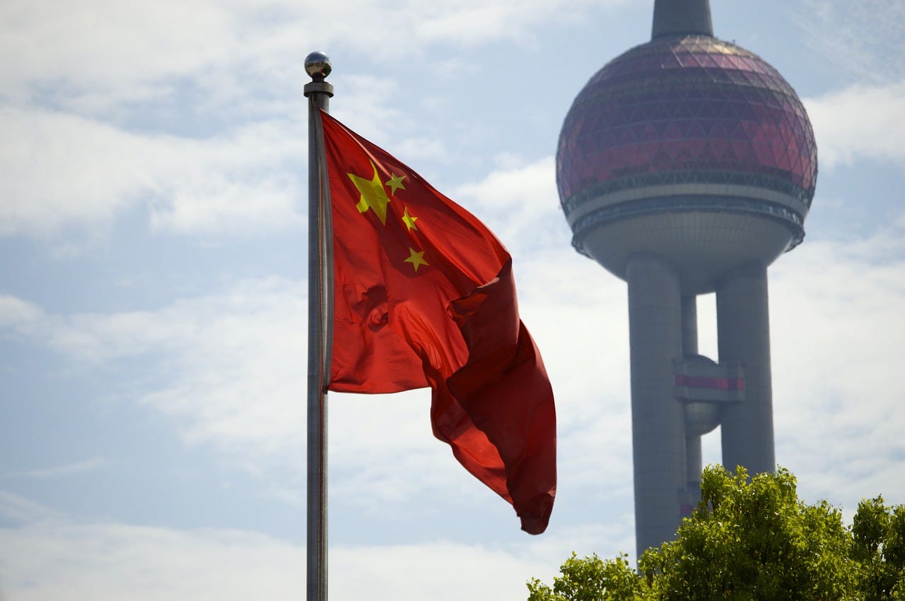 photograph of chinese flag in shanghai