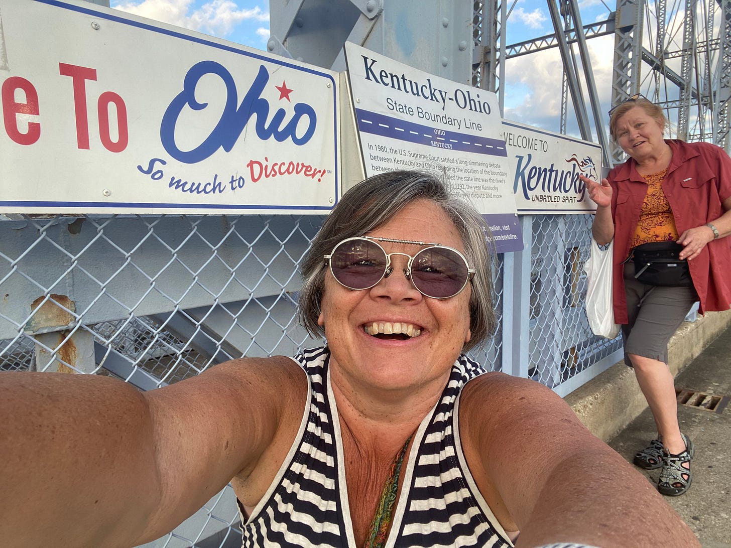 At the Ohio-Kentucky border on the Purple People Bridge between Cincinnati and Covington with my Kentucky cousin Mary