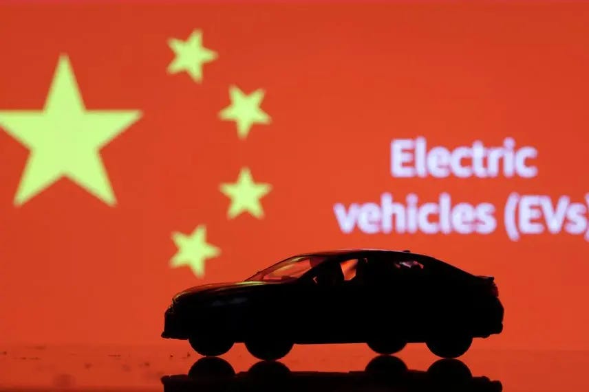 Car miniature, \"Electric vechicles (EVs)\" words and Chinese flag are seen in this illustration taken, September 26, 2023. REUTERS/Dado Ruvic/Illustration , Reuters