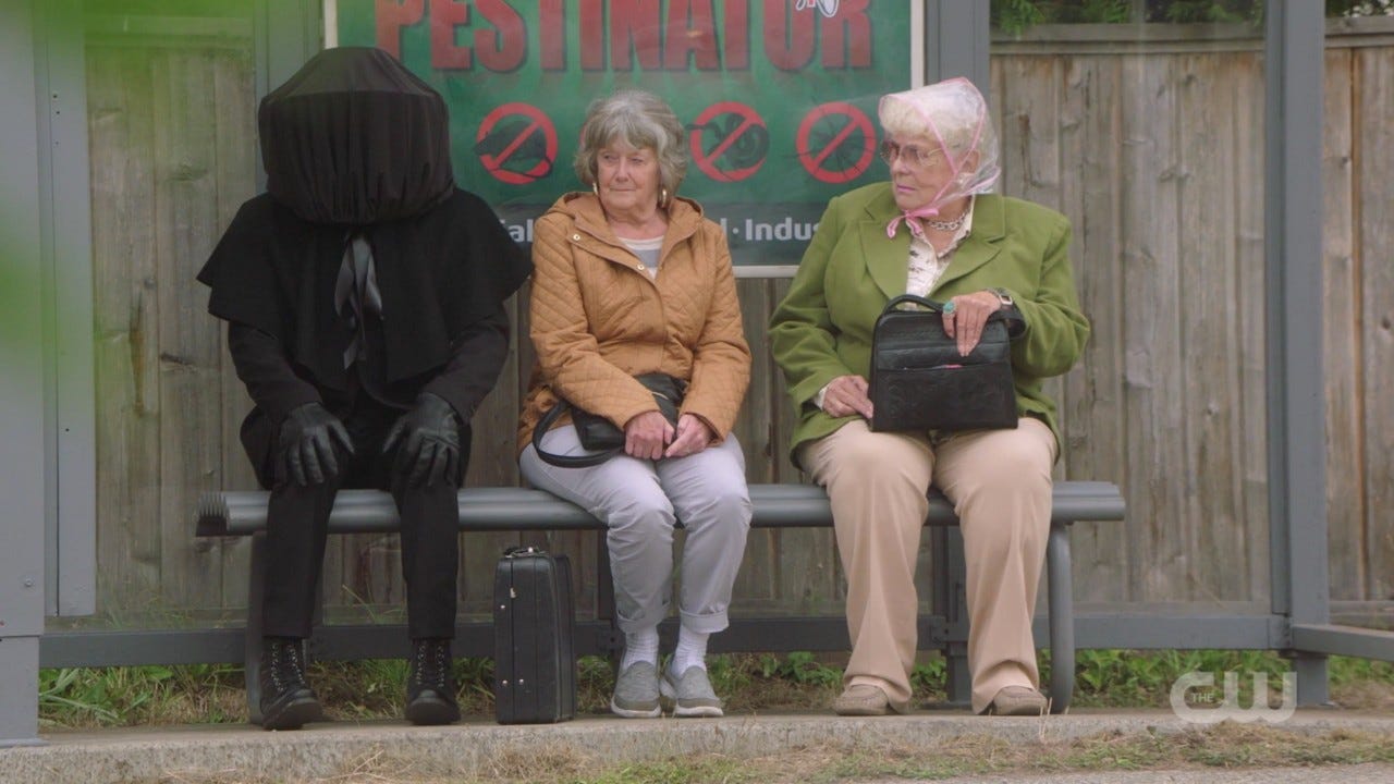 supernatural musca fly man sitting at bus stop with old women 1406