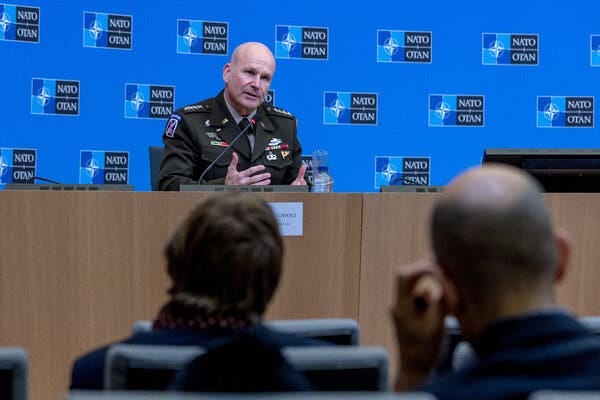 NATO’s supreme commander, Christopher Cavoli, talks in front of a microphone behind a desk at NATO headquarters in January.