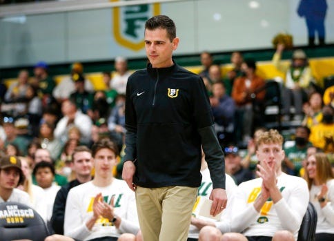 SAN FRANCISCO, CALIFORNIA – MARCH 13: University of San Francisco head coach Todd Golden heads to the podium to speak before their NCAA Tournament selection at the Sobrato Center in USF in San Francisco, Calif., on Sunday, March 13, 2022. (Nhat V. Meyer/Bay Area News Group)
