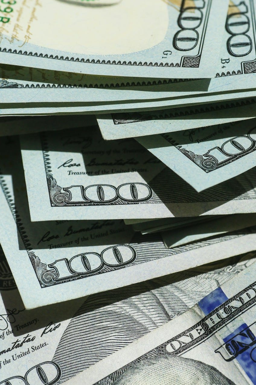 stack of US one hundred dollar bills stack of US one hundred dollar bills