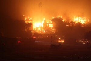 Structures burn during the Palisades Fire.