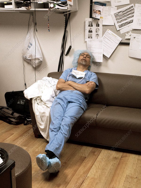 Exhausted surgeon sleeping - Stock Image - C029/9286 - Science Photo Library