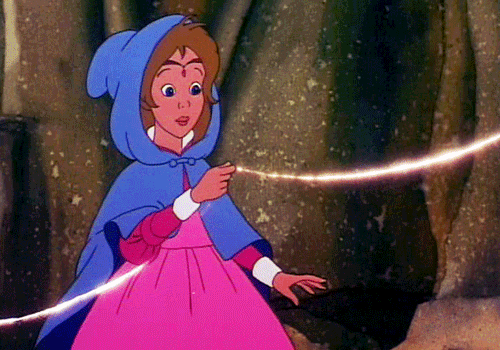 A small child princess in a pink dress holds a piece of golden string - a gif from the animated film The Princess & the Goblin