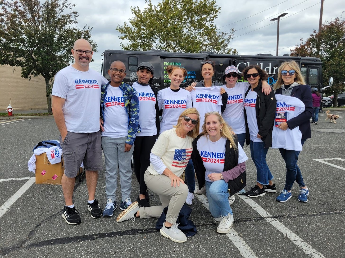 American Values 2024 organizer Michael Kane, left, joins Kennedy supporters at the CHD bus tour Long Island, New York event on Sunday,  Oct. 8, 2023.