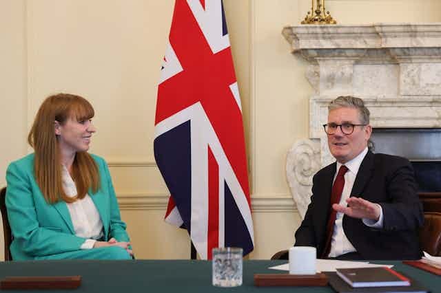 Angela Rayner and Keir Starmer sitting at a table inside Number 10