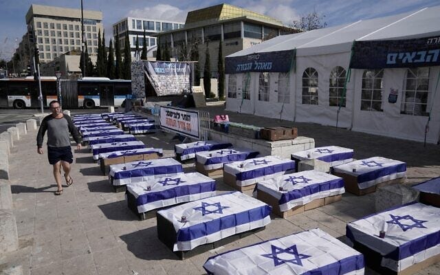 2S6H3FX Symbolic coffins are displayed in Jerusalem to protest a hostage deal as Israel's security cabinet is set to convene to decide whether to approve a deal that would release dozens of hostages held by militants in Gaza and pause the 15-month-war, Friday, Jan. 17, 2025. (AP Photo/Mahmoud Illean)