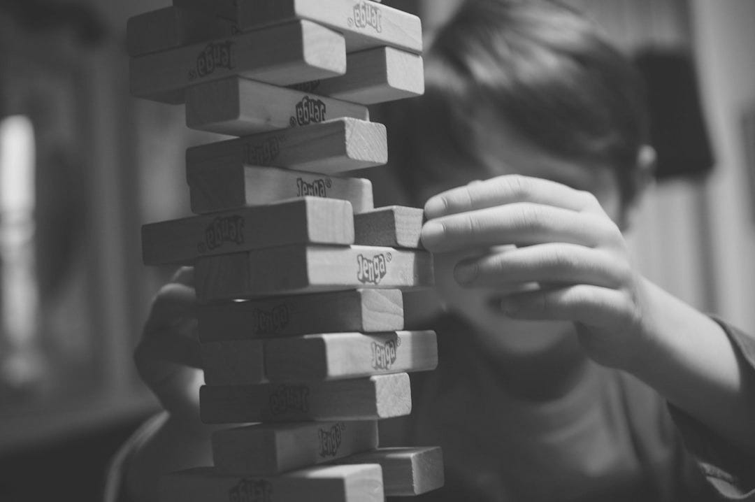 boy playing jenga