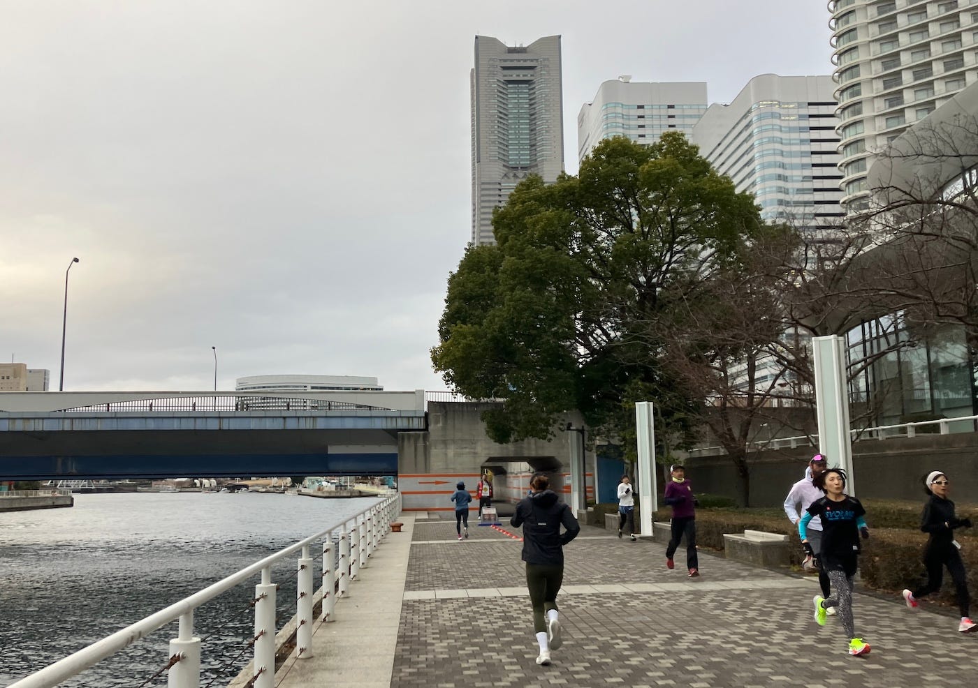 Running on concrete paths towards cones and a marshal at the turnaround point