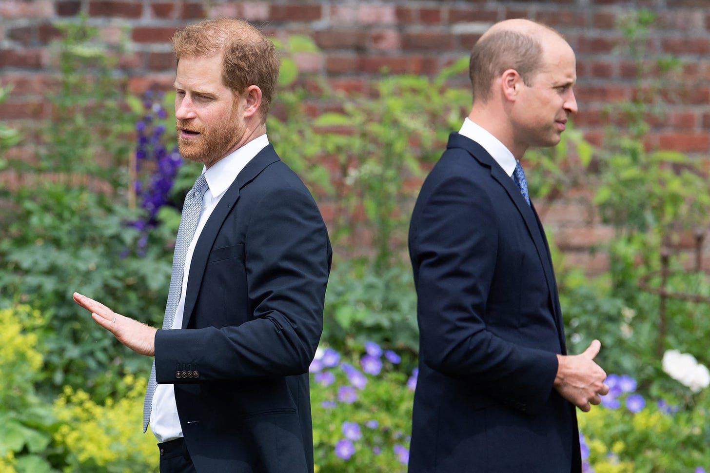 prince harry and prince william turn backs on each other