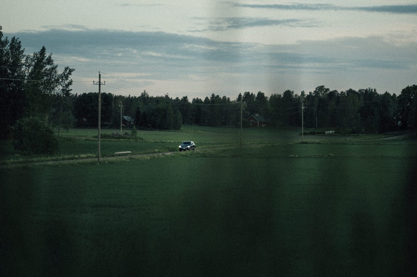 car driving through a finnish countryside scenery
