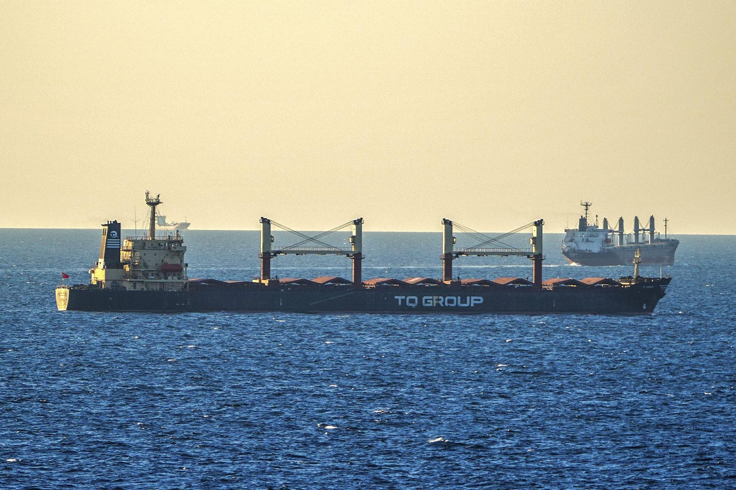 Bulk grain cargo ship TQ Samsun is anchored in the Black Sea near the entrance of the Bosphorus Strait in Istanbul, Turkey.