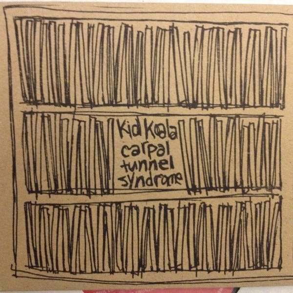 The cover of Kid Koala’s CARPAL TUNNEL SYNDROME. It is a sketch, in black pen, of three shelves filled with what I presume are vinyl albums, we can only see the spines.