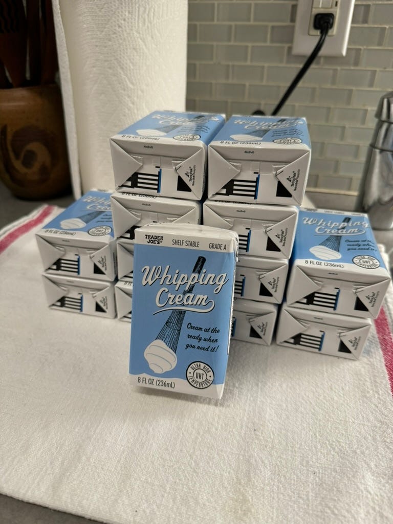 Boxes of shelf stable whipping cream from Trader Joe's.