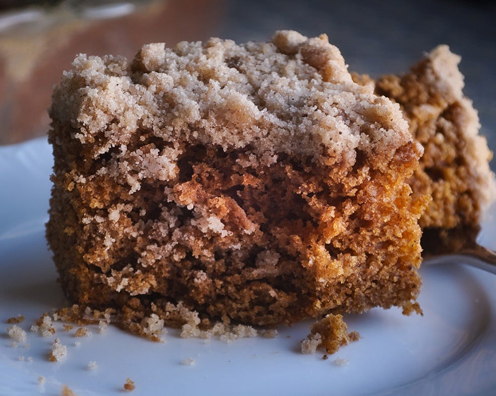 A partially eaten piece of gingerbread on a plate.