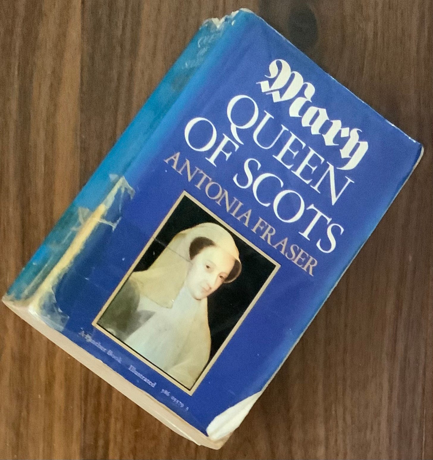 A battered paperback copy of Mary Queen of Scots by Antonia Fraser.