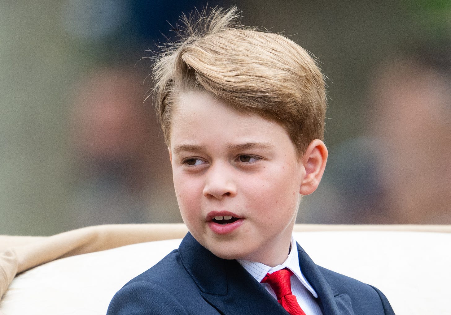 Prince George wearing blazer and red tie