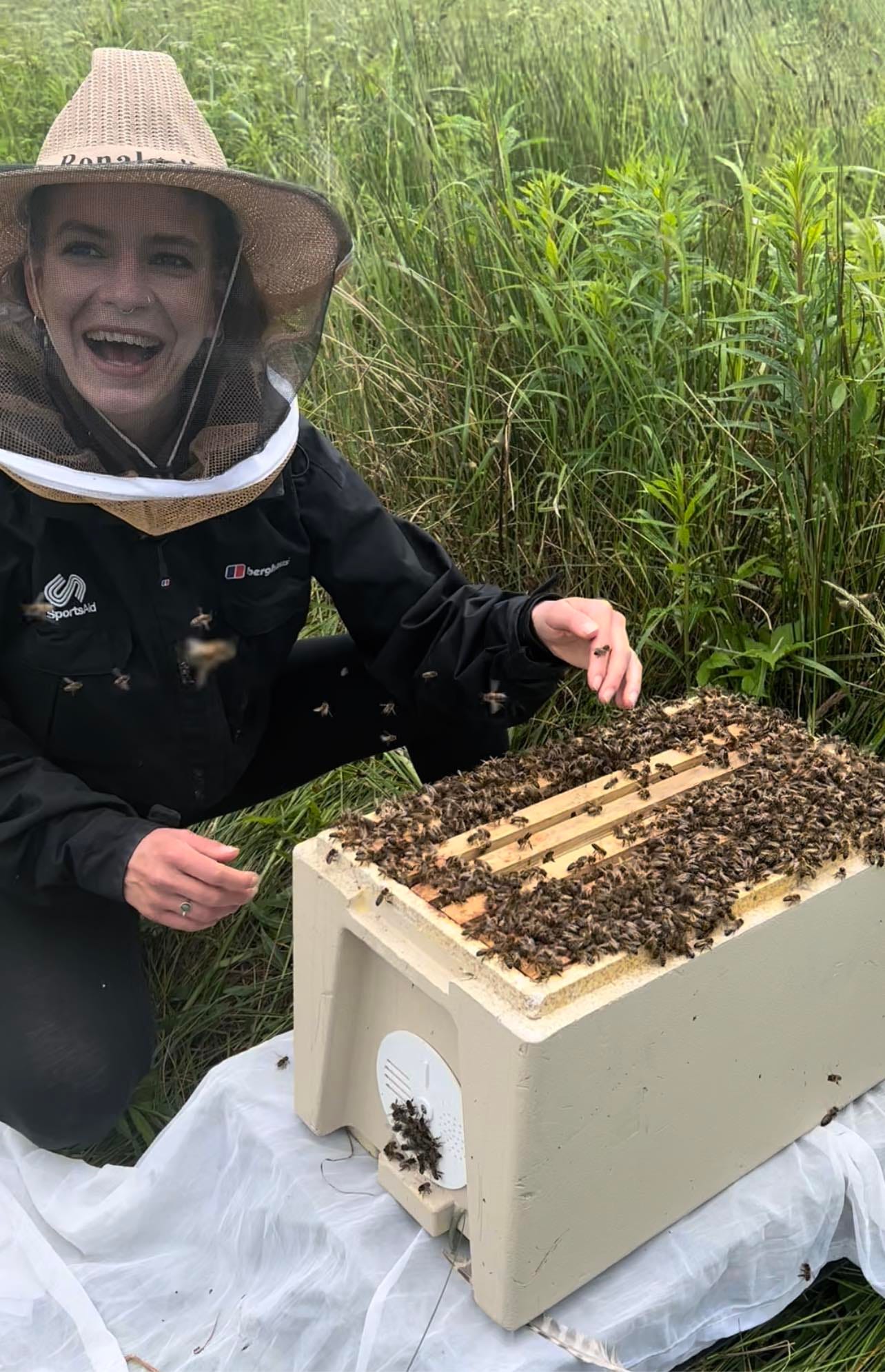 Titanilla, founder of Beewitching Embassy with her native Western European dark honey bees 