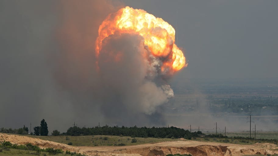 "Smoke and flames rise from an explosion during a fire at a military training ground in the Kirovske district, Crimea, July 19, 2023.