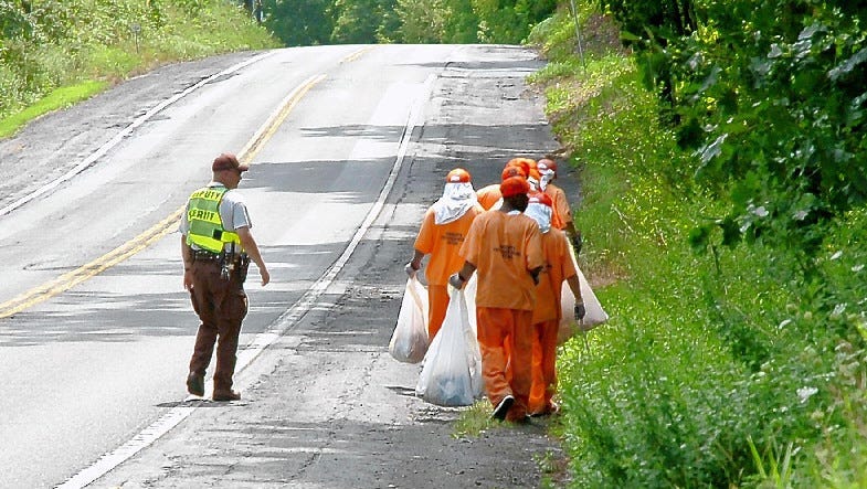 Work-release inmates clean up Monroe County's roadways