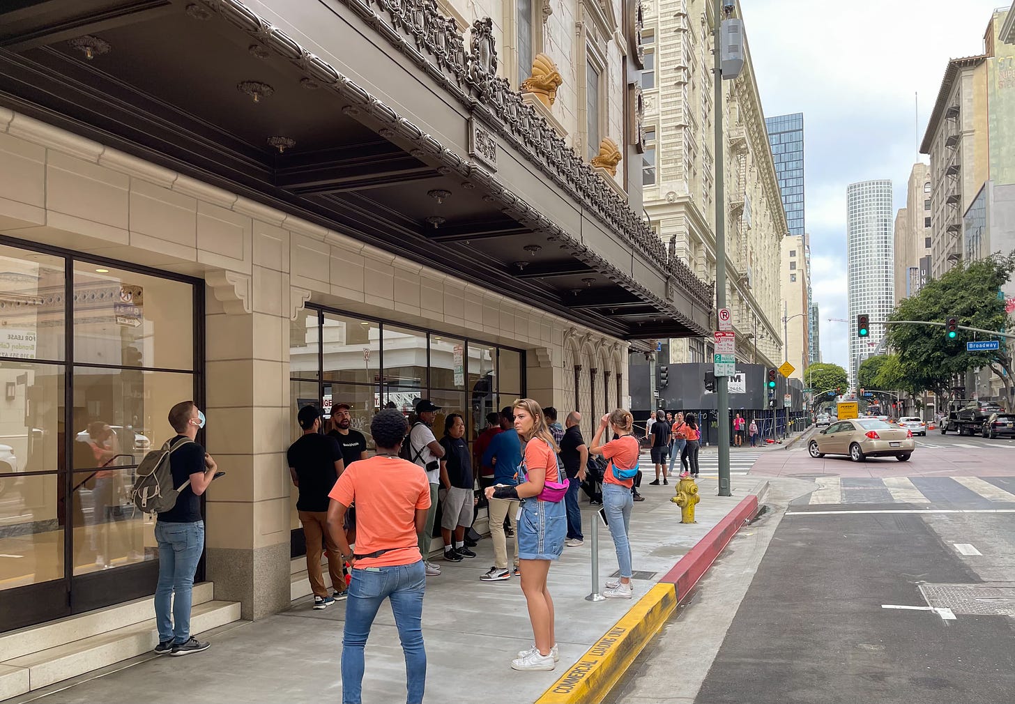 The line at Apple Tower Theatre 90 minutes before opening. Customers are lined up halfway around the perimeter of the store.