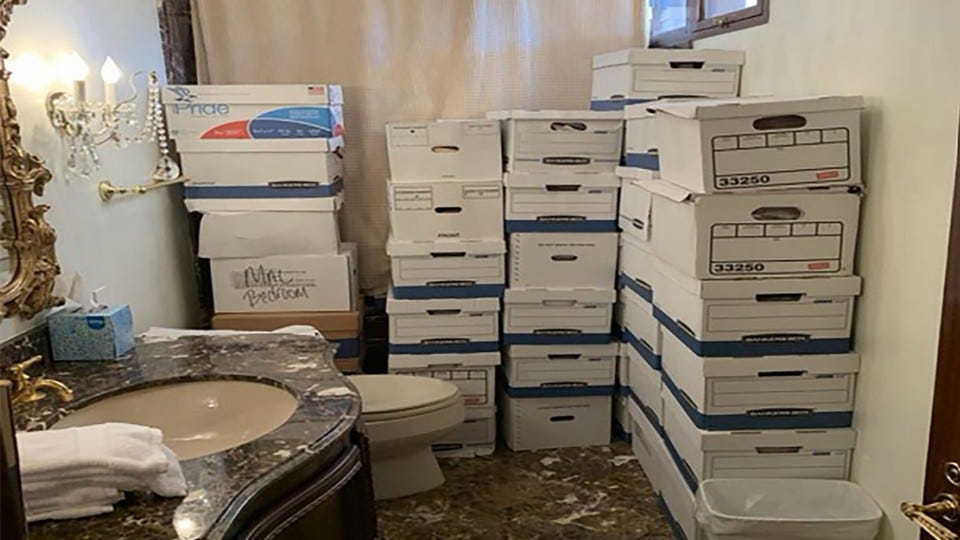 In a handout photo provided by the U.S. Department of Justice, stacks of boxes are seen in a bathroom and shower in the Mar-a-Lago Club’s Lake Room at former President Donald Trump’s estate in Palm Beach, Florida.