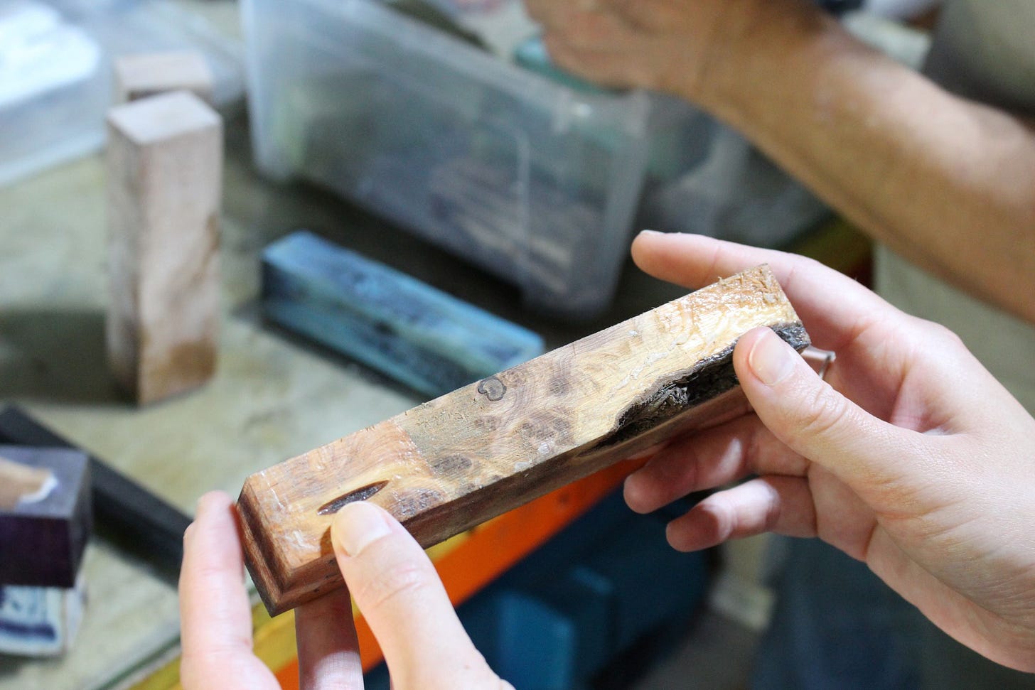 Holding a rectangular piece of bog oak that will become a handle