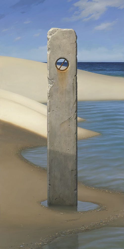 A smooth stone piling stands tall at the edge of the water on a white sand beach. Set near the top, a circle wrought in rusted iron provides a view through to where the water meets the shore. The circle is bisected by a diagonal like a no symbol. Water pools at the base of the piling. The withdrawn tide has left a wavy line of white pebbles deposited along the sinuous water line.