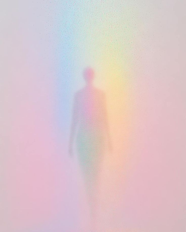 This may contain: a blurry image of a person walking in the fog