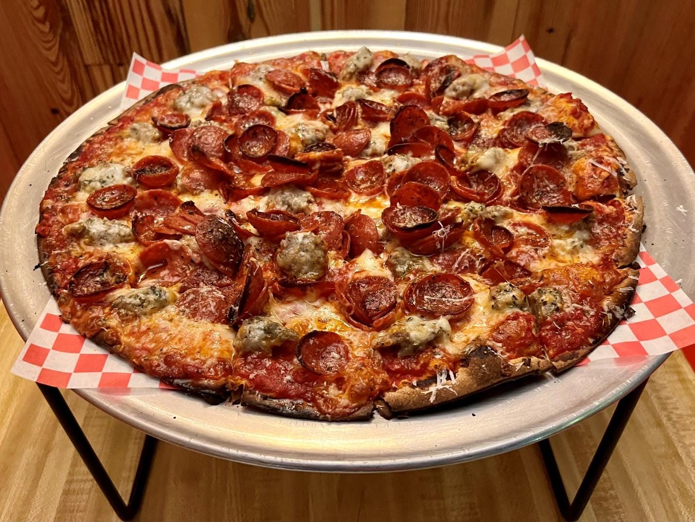 A pizza with pepperoni and cheese

Description automatically generated with low confidence