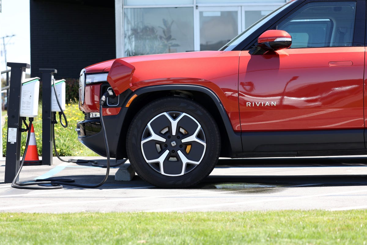 SOUTH SAN FRANCISCO, CALIFORNIA - AUGUST 08: A Rivian electric truck sits parked in front of a Rivian service center on August 08, 2023 in South San Francisco, California. Electric vehicle maker Rivian reported better-than-expected second-quarter earnings with revenue of $1.12 billion compared to $661,000 in the first quarter. Production and deliveries increased by 50 percent. (Photo by Justin Sullivan/Getty Images)