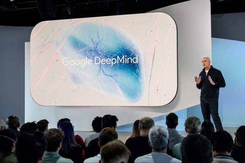 Rick Osterloh, Google’s senior vice president, Devices & Services, stands before a Deep Mind logo as he speaks during a product launch event