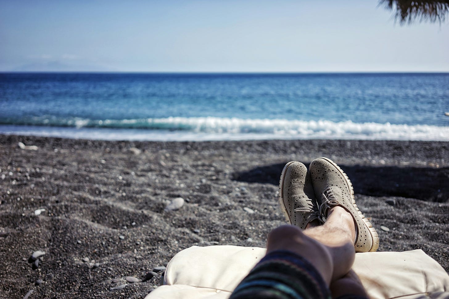 Photo of Person Resting on a Beach