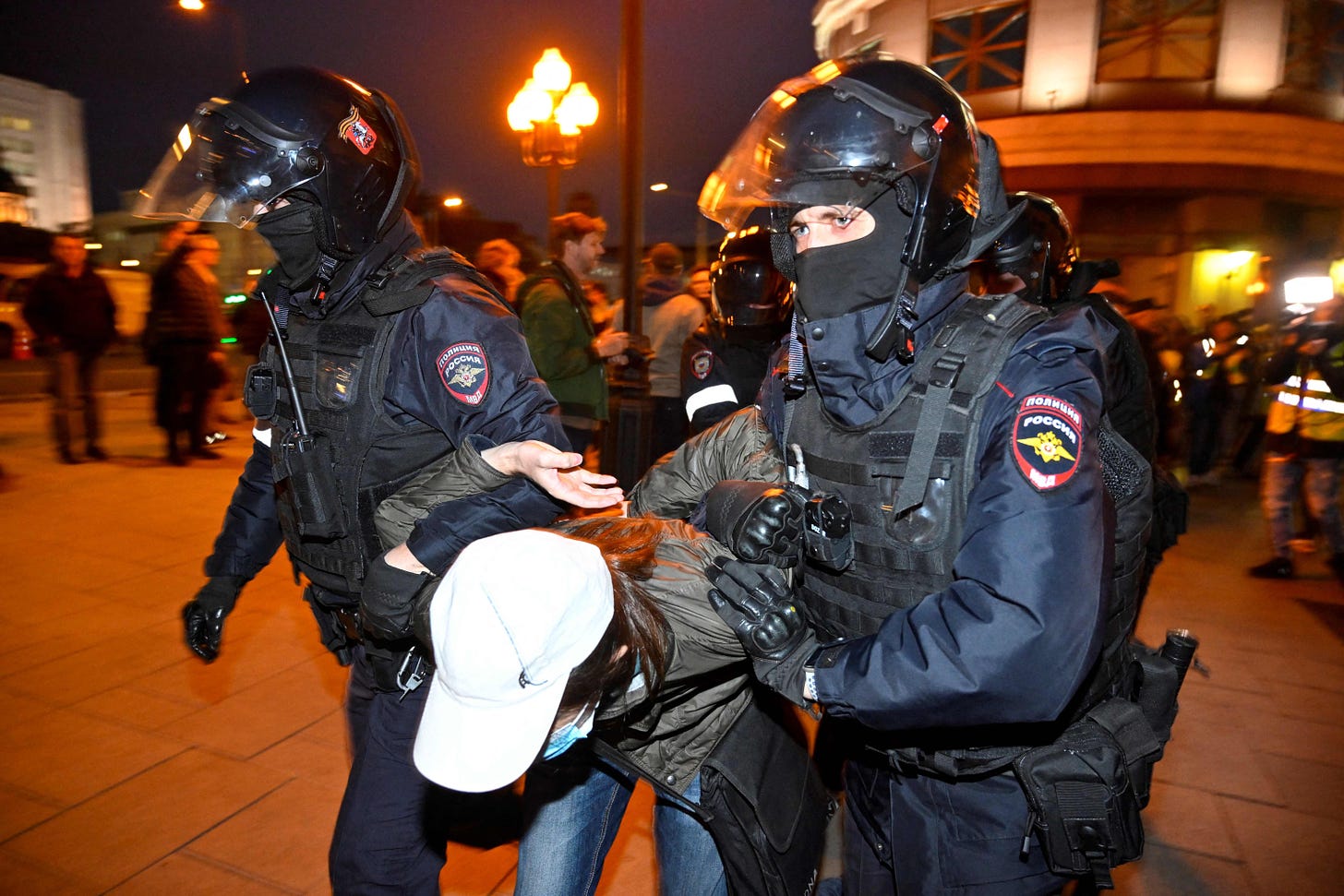 A demonstrator being dragged away in Moscow