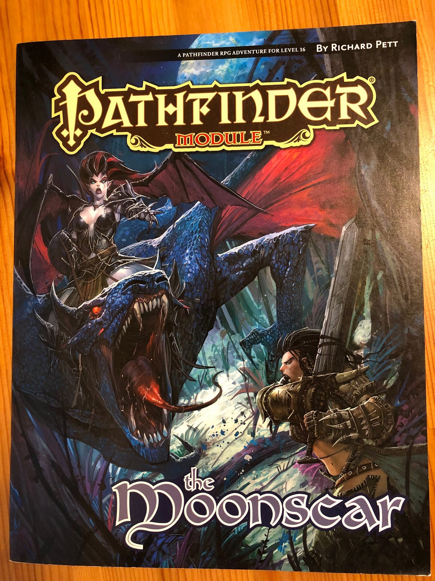 Cover: Pathfinder Module: The Moonscar; illustration of a succubus riding a dragon attacking an adventurer.