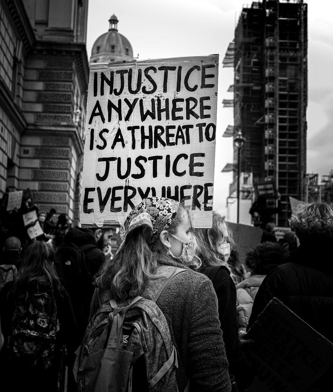 grayscale photo of people walking on street