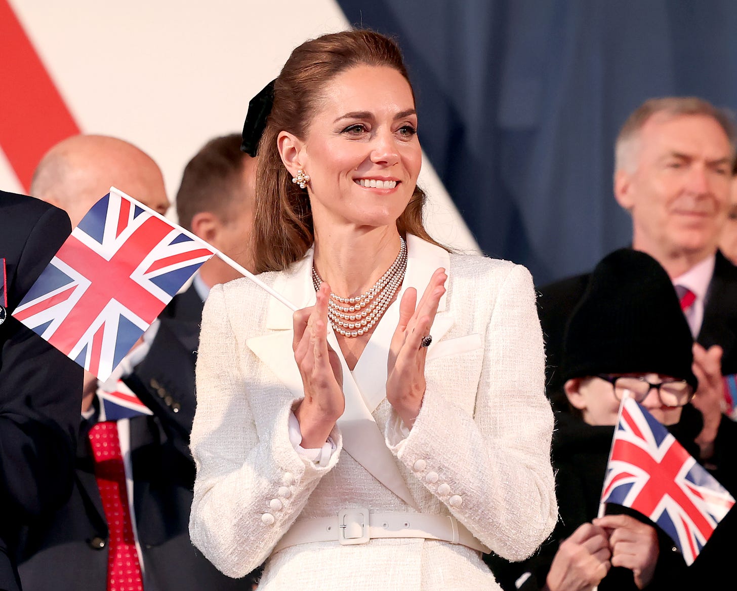 Princess Kate smiling with flag